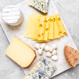 Cheese platter with an assortment of different cheeses.