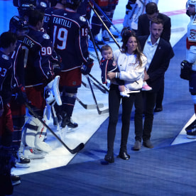 Meredith Gaudreau walks onto the ice during a remembrance for her husband, Columbus Blue Jackets player Johnny Gaudreau before the home opener against the Florida Panthers at Nationwide Arena on October 15, 2024 in Columbus, Ohio. 